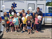 Doddridge Co. Ambulance Authority employees with schoolchildren during EMS Week.